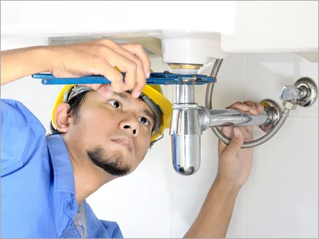 Plumber in Luton repairing a boiler for home heating system